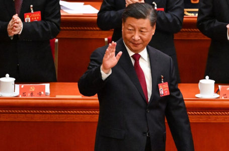 China’s President Xi Jinping waves as he arrives for the opening session of the 20th Chinese Communist Party’s Congress at the Great Hall of the People in Beijing on October 16, 2022. (Photo by Noel CELIS / AFP)
