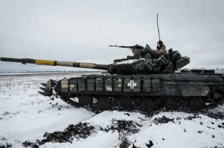 Ukrainian serviceman of the first tank brigade Igor, 26, who has worked as a gunner for four years, rides on the T-64 Main Battle Tank near the frontline in the Donetsk region on February 4, 2023, amid the Russian invasion of Ukraine. (Photo by YASUYOSHI CHIBA / AFP)