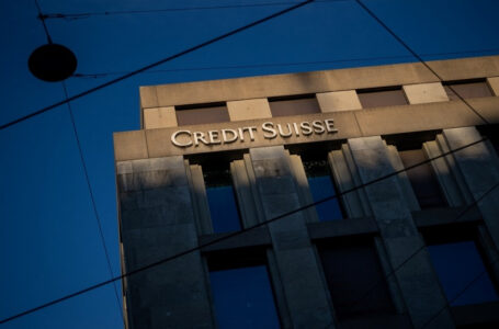 A sign of Credit Suisse bank is seen on a branch in Geneva, on March 15, 2023. – Asian markets slid on March 16, 2023 led again by banks, with contagion talk sweeping across trading floors owing to fears about European giant Credit Suisse. (Photo by Fabrice COFFRINI / AFP)