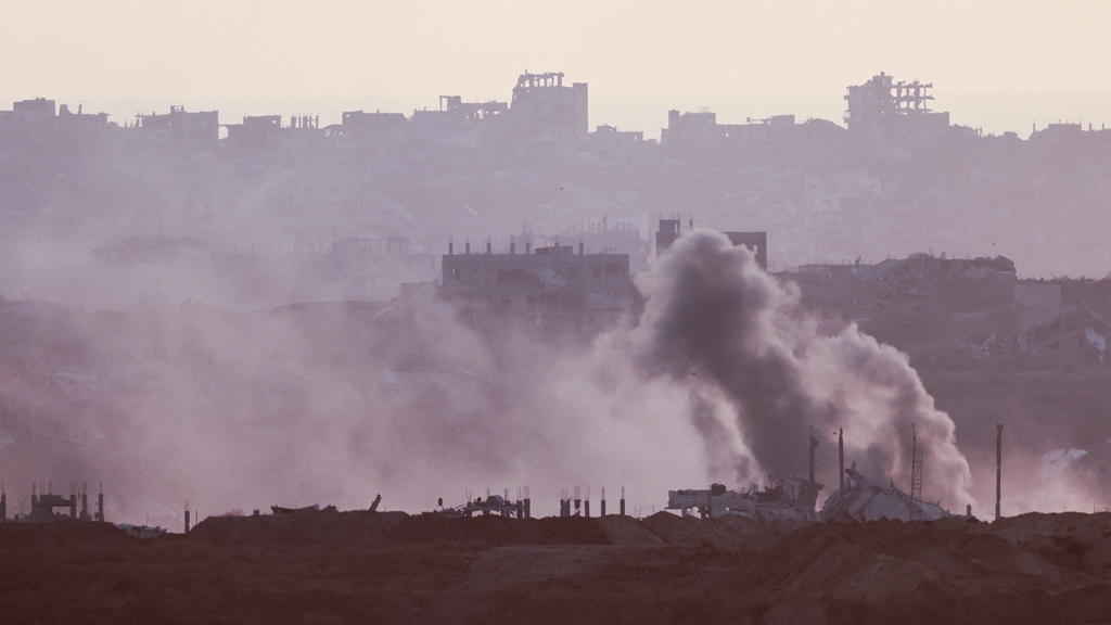 A picture taken from Israeli side of the border with the Gaza Strip shows smoke billowing following Israeli bombardment in the besieged Palestinian territory on June 4, 2025. (Photo by Menahem KAHANA / AFP)